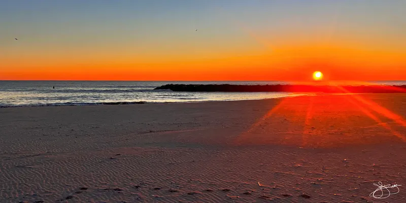 Solo Surfer at Sunrise