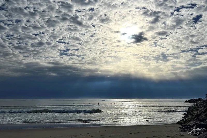 Light Rays Glow on the Surfers