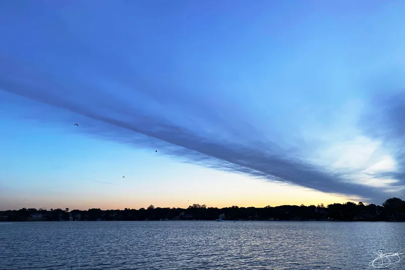 Wind Whipped Clouds Over the River