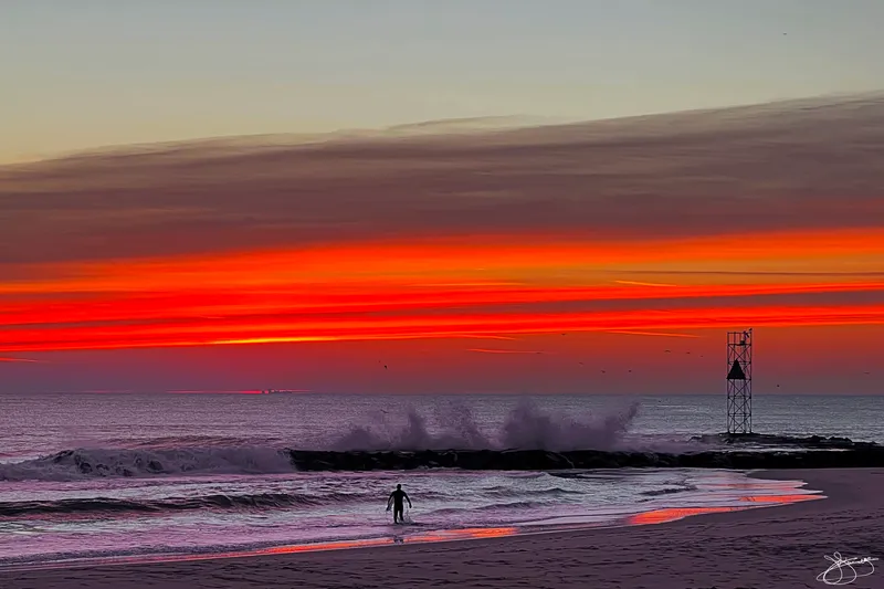 Lone Surfer as the Dawn Sky Explodes