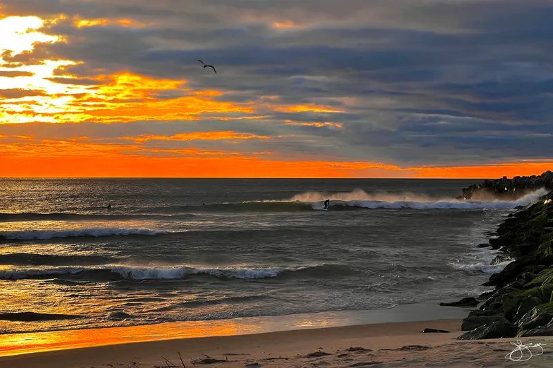 Surfers Enjoying the Suns Winter Warmth